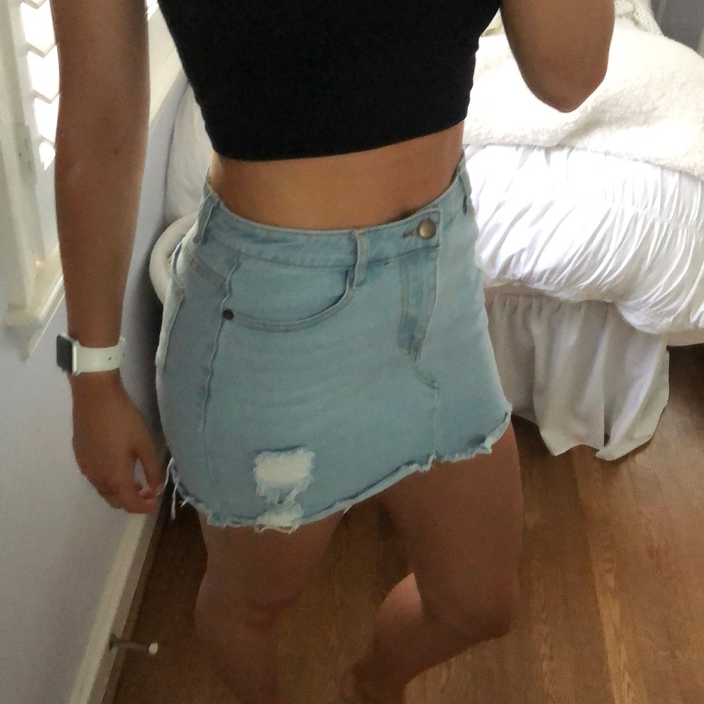 Distressed light denim skirt